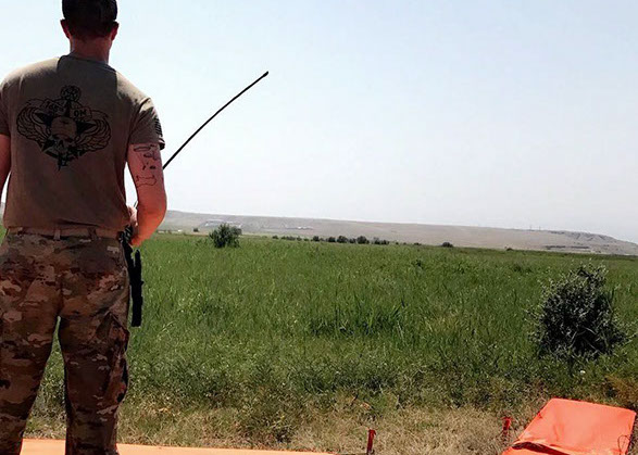 Aerial delivery supervisor, Staff Sergeant Romeo overseeing air drop