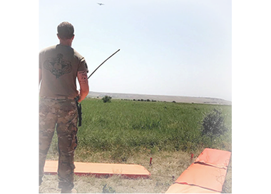 Aerial delivery supervisor, Staff Sergeant Romeo overseeing air drop